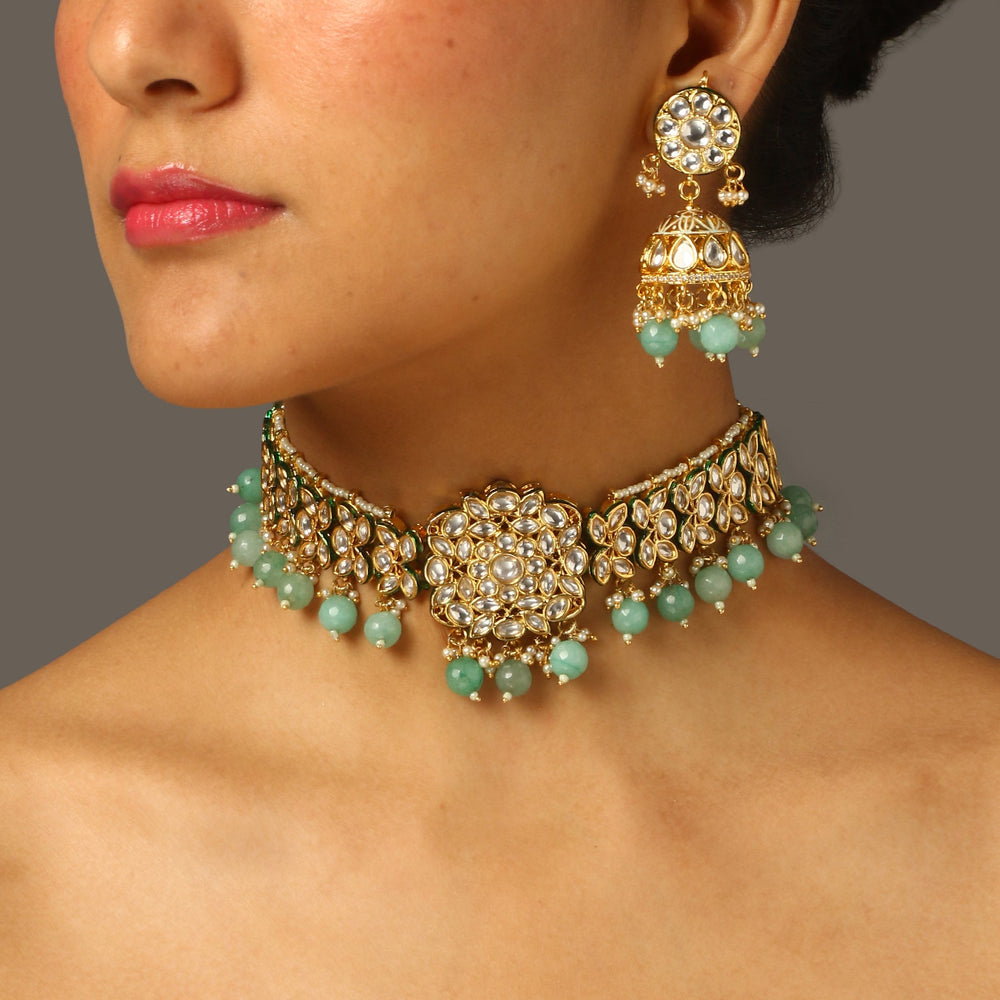 women wearing sea green polki choker set